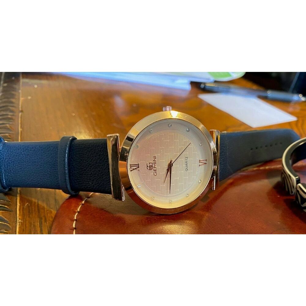 Women's 43mm Gold Tone Gemini Watch, Crystal Accented Face, Black Band